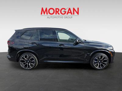 2026 BMW X5 M — rear three-quarter view