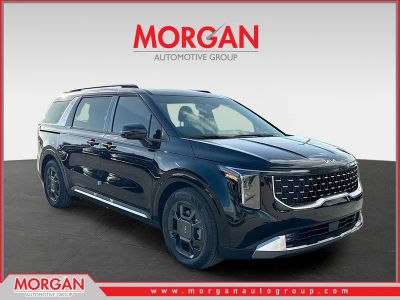2026 Kia Carnival SX in Aurora Black Pearl — front three-quarter view