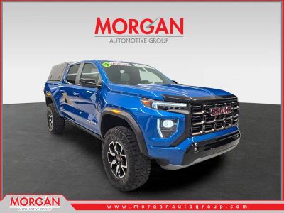 2024 GMC Canyon 4WD AT4X in Dynamic Blue Metallic — front three-quarter view