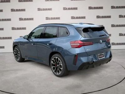 2026 BMW X3 — rear three-quarter view