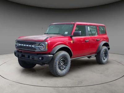 2026 Ford Bronco Badlands in Ruby Red Metallic — front three-quarter view