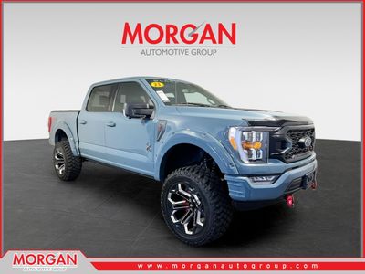 2023 Ford F-150 XLT in Area 51 Blue — front three-quarter view
