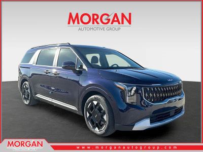 2026 Kia Carnival EX in Deep Chroma Blue — front three-quarter view