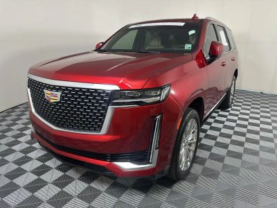 2023 Cadillac Escalade Premium Luxury in Radiant Red Tintcoat — front three-quarter view
