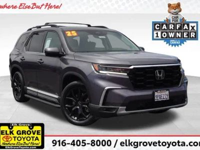2025 Honda Pilot Elite in Gray — front three-quarter view