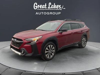 2024 Subaru Outback Limited in Crimson Red Pearl — front three-quarter view