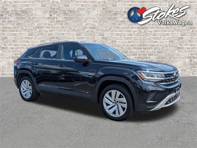 2022 Volkswagen Atlas Cross Sport 3.6L V6 SE w/Technology in Black — front three-quarter view