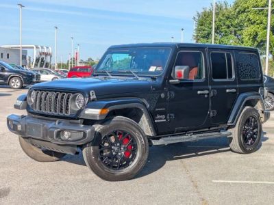2024 Jeep Wrangler Sahara in Black — front three-quarter view