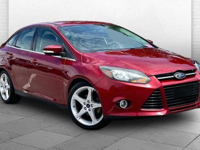 2013 Ford Focus Titanium in Ruby Red Metallic — front three-quarter view