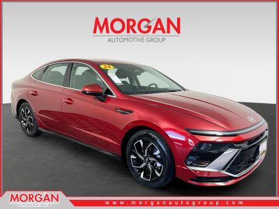 2024 Hyundai Sonata SEL in Ultimate red — front three-quarter view