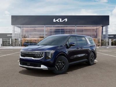 2026 Kia Carnival LX in Deep Chroma Blue — front three-quarter view