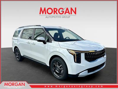 2026 Kia Carnival Hybrid EX in White — front three-quarter view