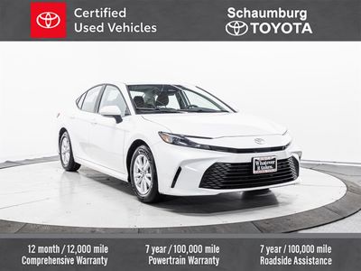 2025 Toyota Camry LE in White — front three-quarter view