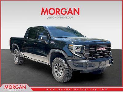 2024 GMC Sierra 1500 AT4X in Onyx Black — front three-quarter view