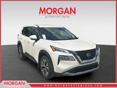 2023 Nissan Rogue SV in Pearl White Tricoat — front three-quarter view