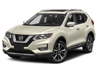 2017 Nissan Rogue SL in Caspian Blue — front three-quarter view