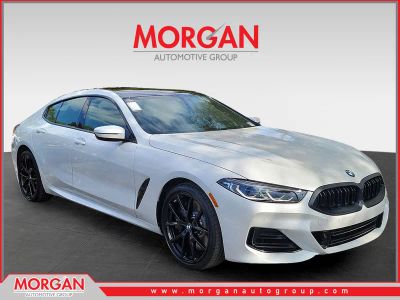 2026 BMW 8 Series 840i in Mineral White Metallic — front three-quarter view