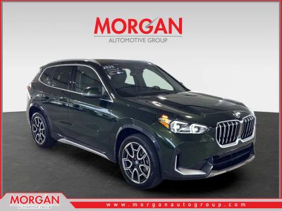 2025 BMW X1 xDrive28i in Green — front three-quarter view