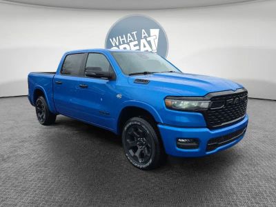 2026 RAM 1500 Big Horn/Lone Star in Hydro Blue Pearlcoat — front three-quarter view