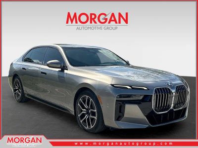 2023 BMW 7 Series 740i in Oxide Grey Metallic — front three-quarter view