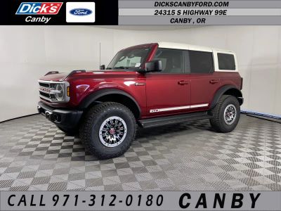 2026 Ford Bronco Outer Banks in Ruby Red Metallic Tinted Clearcoat — front three-quarter view