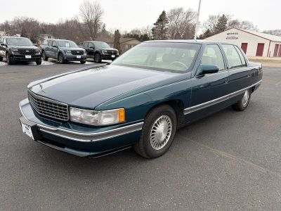 1995 Cadillac Deville 4DR SEDAN in Green — front three-quarter view