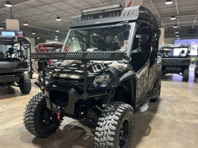 2025 Honda® Pioneer 1000-6 Deluxe Crew TrueTimber Atera Camo — front three-quarter view
