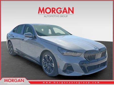 2026 BMW 5 Series 550e xDrive — front three-quarter view