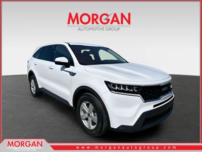 2023 Kia Sorento LX in Glacial White Pearl — front three-quarter view