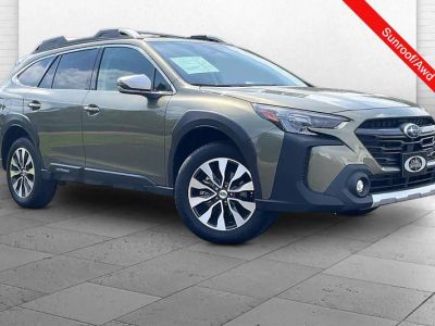 2025 Subaru Outback Touring in Autumn Green Meta — front three-quarter view