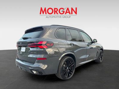 2026 BMW X5 — rear three-quarter view