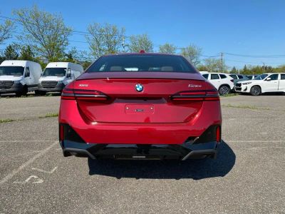 2027 BMW 5 Series — rear three-quarter view