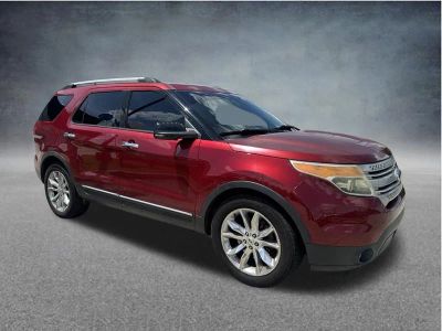 2014 Ford Explorer XLT in Ruby Red Metallic — front three-quarter view