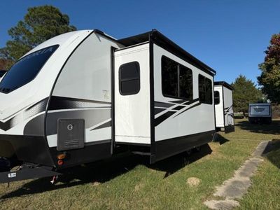 2023 Dutchmen Astoria — rear three-quarter view