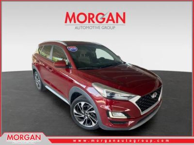 2020 Hyundai Tucson Sport in Red — front three-quarter view