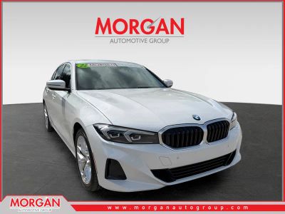 2025 BMW 3 Series 330i in Mineral White Metallic — front three-quarter view