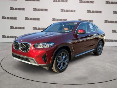 2025 BMW X4 xDrive30i in Aventurin Red Metallic — front three-quarter view