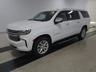 2023 Chevrolet Suburban Premier in White — front three-quarter view