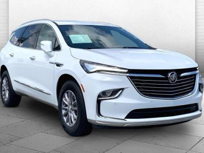 2023 Buick Enclave Essence in Summit White — front three-quarter view