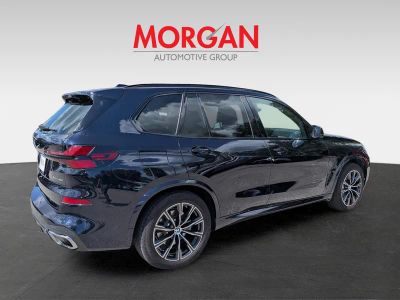 2026 BMW X5 — rear three-quarter view