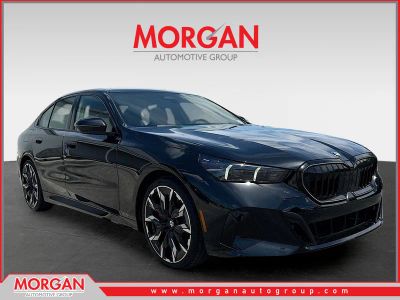 2027 BMW 5 Series 530i in Black Sapphire Metallic — front three-quarter view