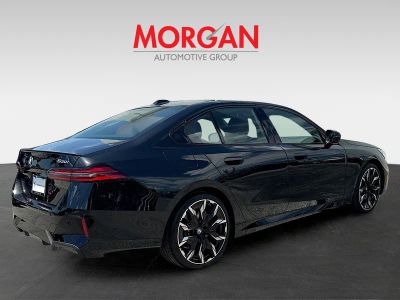 2027 BMW 5 Series — rear three-quarter view