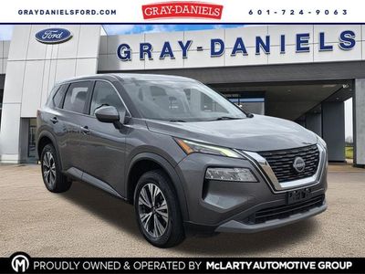 2023 Nissan Rogue SV in Gun Metallic — front three-quarter view