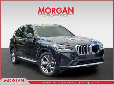 2023 BMW X3 xDrive30i in Black Sapphire Metallic — front three-quarter view