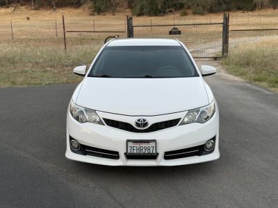 2014 Toyota Camry — rear three-quarter view
