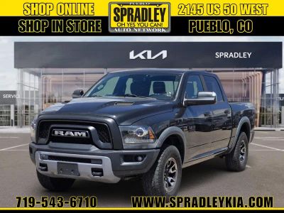 2016 RAM 1500 Rebel in Brilliant Black Crystal Pearlcoat — front three-quarter view