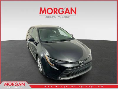 2024 Toyota Corolla LE in Midnight Black Metallic — front three-quarter view