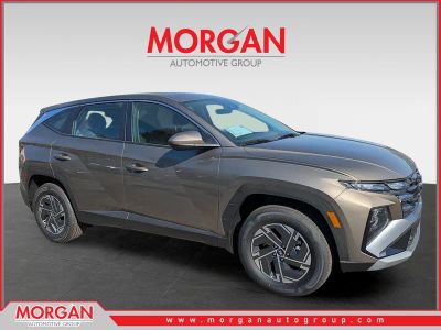 2026 Hyundai TUCSON HYBRID Blue SE in Cashmere Bronze — front three-quarter view