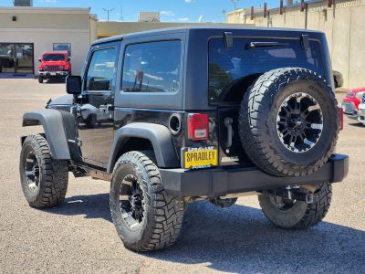 2013 Jeep Wrangler — rear three-quarter view