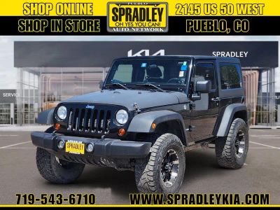 2013 Jeep Wrangler Sport in Black — front three-quarter view